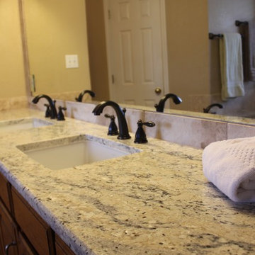 Undermount Marble Tub with Bianco Romano Granite and Frameless Shower