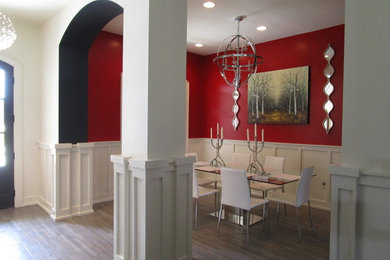 Minimalist ceramic tile dining room photo in Other with red walls