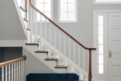 Inspiration for a large coastal front door remodel in Minneapolis with white walls and a white front door
