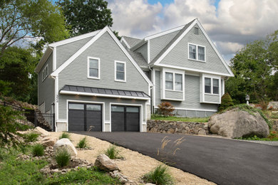 Large trendy attached two-car garage workshop photo in Boston