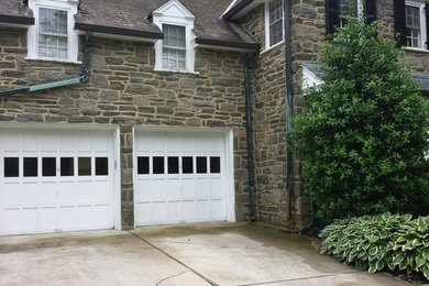 Example of a mid-sized classic attached two-car garage design in Philadelphia