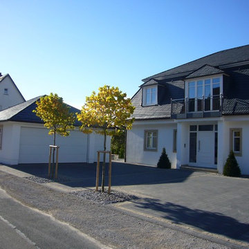 Haus Hillebrand - Holzhaus mit Mansarddach und Putzfassade