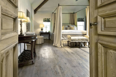 Inspiration for a rustic bedroom remodel in Houston