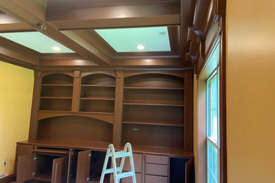 Example of a mid-sized classic coffered ceiling home office design in Louisville