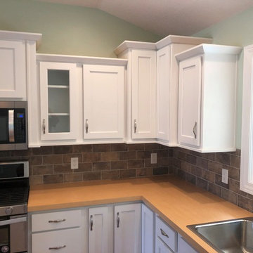 New Construction Milan, IL Koch Express Painted White Formica Amber Maple