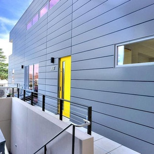 Mid-sized contemporary gray one-story concrete flat roof idea in San Francisco