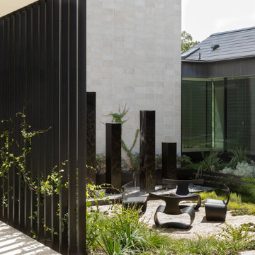 Driftwood Courtyard Garden with Patrick Naggar Chairs