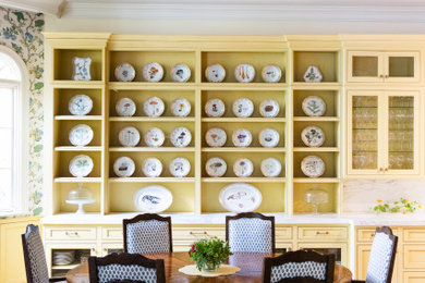 Example of a french country beige floor and coffered ceiling dining room design in Other