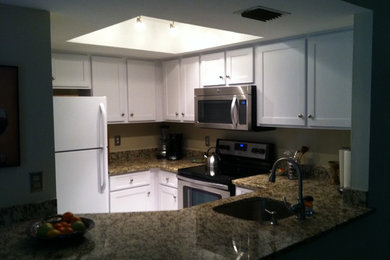 Inspiration for a small transitional u-shaped travertine floor open concept kitchen remodel in Other with a drop-in sink, shaker cabinets, white cabinets, granite countertops, multicolored backsplash, stone slab backsplash, stainless steel appliances and no island