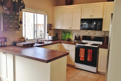 Kitchen - kitchen idea in Other with white cabinets and concrete countertops