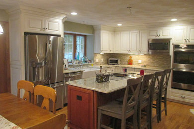 Inspiration for a large timeless u-shaped light wood floor and beige floor eat-in kitchen remodel in Providence with a farmhouse sink, raised-panel cabinets, white cabinets, granite countertops, stainless steel appliances, an island, gray countertops, gray backsplash and matchstick tile backsplash