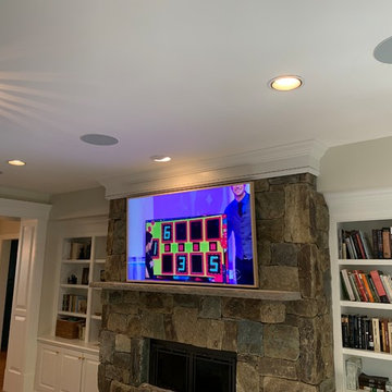 Samsung 65' FRAME Art Panel over Stone Fireplace with surround system