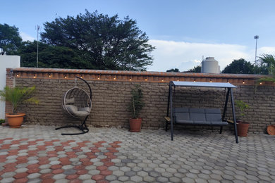 Inspiration for a rustic brick patio remodel in Mexico City