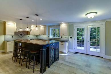 Mid-sized farmhouse l-shaped concrete floor and gray floor eat-in kitchen photo in Montreal with an undermount sink, shaker cabinets, white cabinets, soapstone countertops, gray backsplash, subway tile backsplash and an island