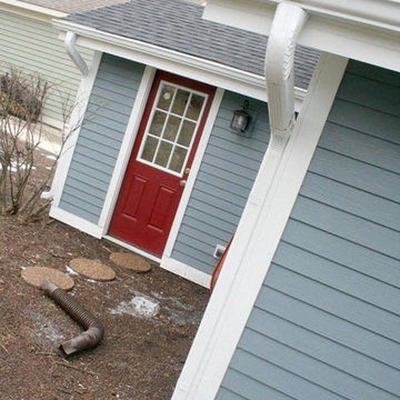 Red Door with Boothbay Blue Hardie Siding, White Trim & Gutters