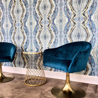 Photo of a medium sized modern study in DC Metro with blue walls and carpet.