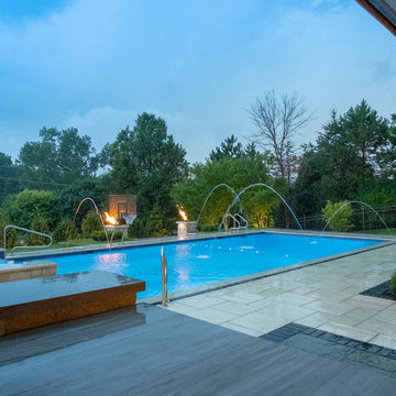 Burr Ridge Lap Pool with Raised Hot Tub and Waterfall
