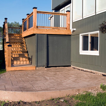 Smith - Cedar deck in Kansas City with stamped concrete patio.