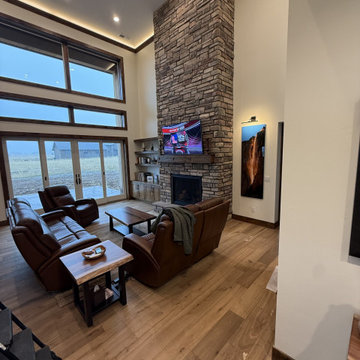 Great Room With Full-Height Stone Fireplace — Arbogast Home, Driggs