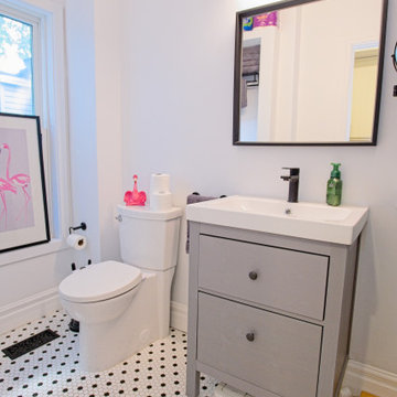 Grey Vanity and White Toilet with Black-and-White Bathroom Floor | East York