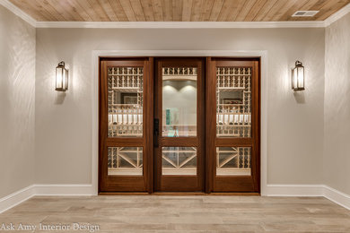 Large transitional wine cellar in Charlotte with ceramic floors and storage racks.