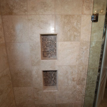 Marble and Travertine With kohler Fixtures and Round Window in Newport Coast