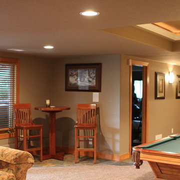 Eye-popping Denver Basement Remodel with hidden bookcase doors and tray ceilings