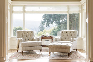 Example of a mid-sized classic formal and enclosed light wood floor and brown floor living room design in San Francisco with white walls, no fireplace and no tv
