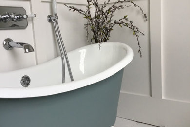 Inspiration for a medium sized contemporary shower room bathroom in Hampshire with shaker cabinets, white cabinets, white walls, light hardwood flooring, white floors, a freestanding vanity unit and panelled walls.