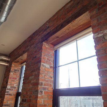 Interior reclaimed brick with barn beam lintels.