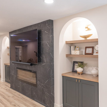 Warm & Inviting Basement Retreat with Custom Bar + Entertainment Center