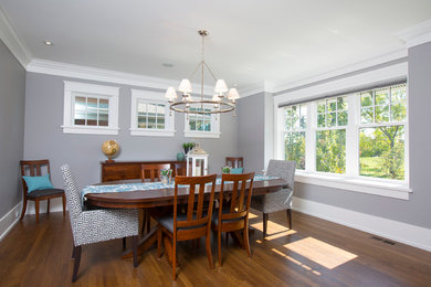 Example of a mid-sized classic dark wood floor enclosed dining room design in Calgary with gray walls and no fireplace