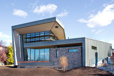 Inspiration for a huge modern exterior home remodel in Calgary
