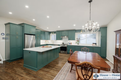 Example of a large transitional l-shaped medium tone wood floor, brown floor and vaulted ceiling eat-in kitchen design in DC Metro with an undermount sink, shaker cabinets, green cabinets, quartz countertops, white backsplash, quartz backsplash, stainless steel appliances, an island and white countertops