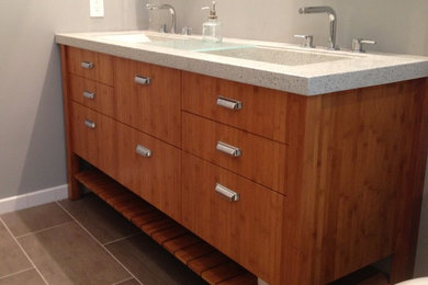 Inspiration for a large contemporary master ceramic tile bathroom remodel in Baltimore with a trough sink, flat-panel cabinets, medium tone wood cabinets, concrete countertops and gray walls