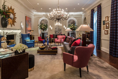 Example of a large transitional formal and enclosed dark wood floor living room design in New York with white walls, a standard fireplace and a plaster fireplace