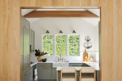 Inspiration for a small contemporary u-shaped light wood floor, beige floor and exposed beam enclosed kitchen remodel in Other with a farmhouse sink, flat-panel cabinets, green cabinets, marble countertops, white backsplash, marble backsplash, paneled appliances, no island and white countertops