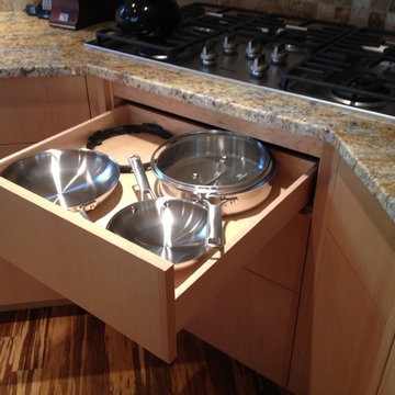 Custom configured drawer and drawer front retaining the same drawer front face a