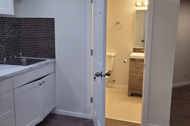 Laundry room photo in Calgary