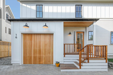 Inspiration for a mid-sized contemporary white two-story wood exterior home remodel in Boston