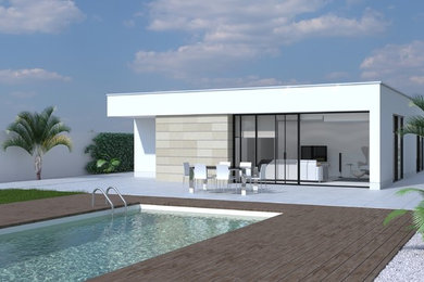 Ejemplo de fachada de casa moderna de tamaño medio de una planta con tejado plano y tejado de varios materiales