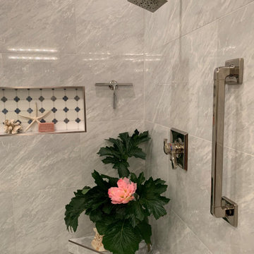 SIMPLE GRAB BAR COMPLEMENTS THE PLUMBING FIXTURES