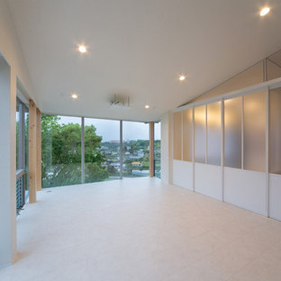 This is an example of a small modern open plan home cinema in Other with white walls, lino flooring and a projector screen.