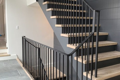 Inspiration for a wooden l-shaped metal railing staircase remodel in Chicago with wooden risers