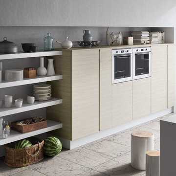 Modern white and light wood kitchen with wood table top