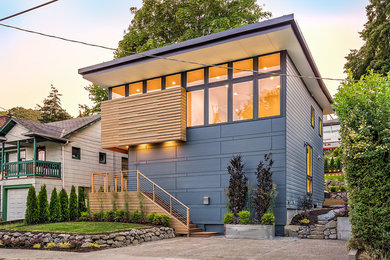 Inspiration for a large contemporary blue three-story house exterior remodel in Seattle