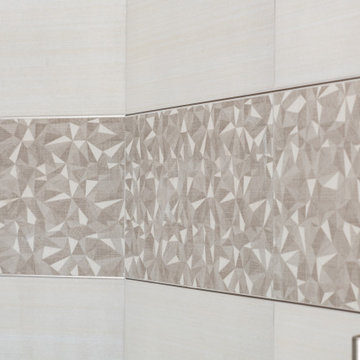 Porcelain Shower Accent with a Geometric Pattern in Bathroom Remodel