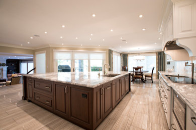Large elegant l-shaped eat-in kitchen photo in Calgary with an undermount sink, raised-panel cabinets, white cabinets, marble countertops, white backsplash, marble backsplash, paneled appliances and an island