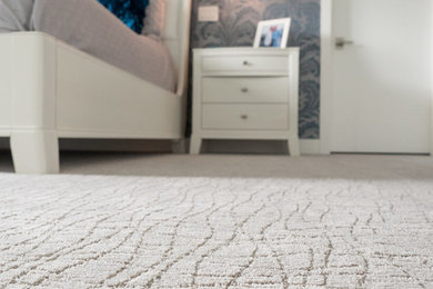 Inspiration for a mid-sized shabby-chic style master carpeted and gray floor bedroom remodel in Edmonton with blue walls