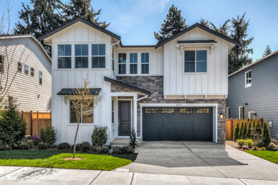 Transitional white two-story board and batten exterior home idea in Seattle